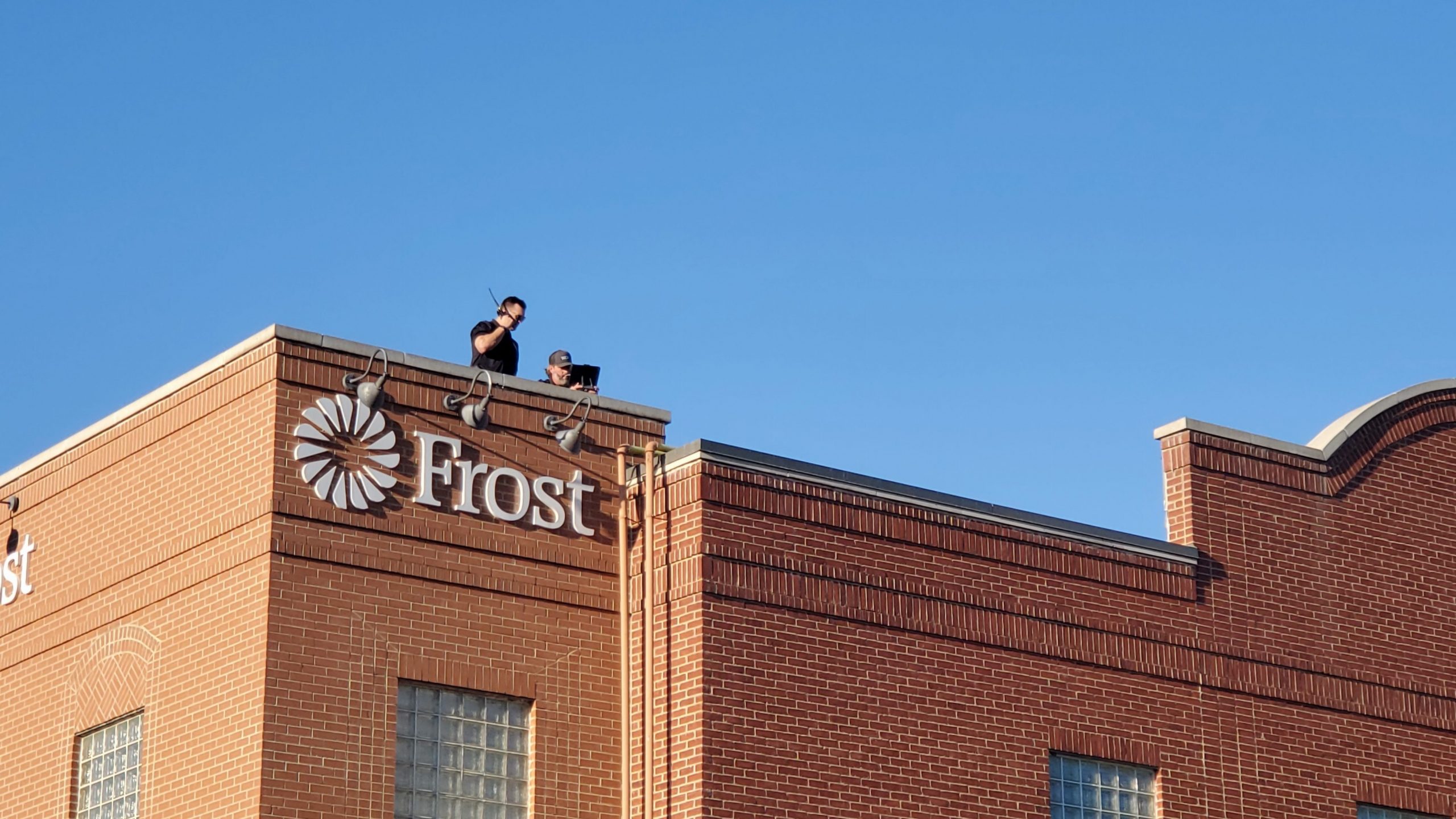 Carrollton Texas Police on top of Frost Bank during Festival at the Switchyard. 